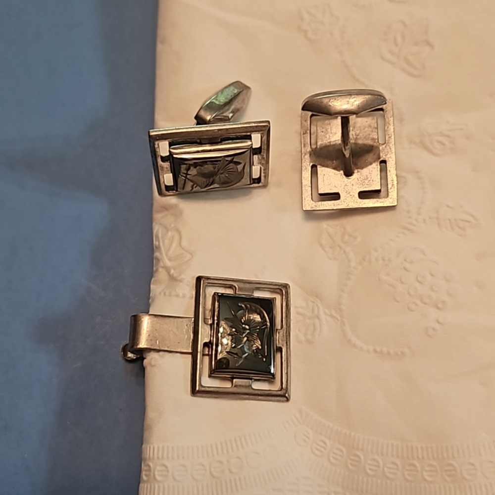 Sterling silver tie clip and cuff links.